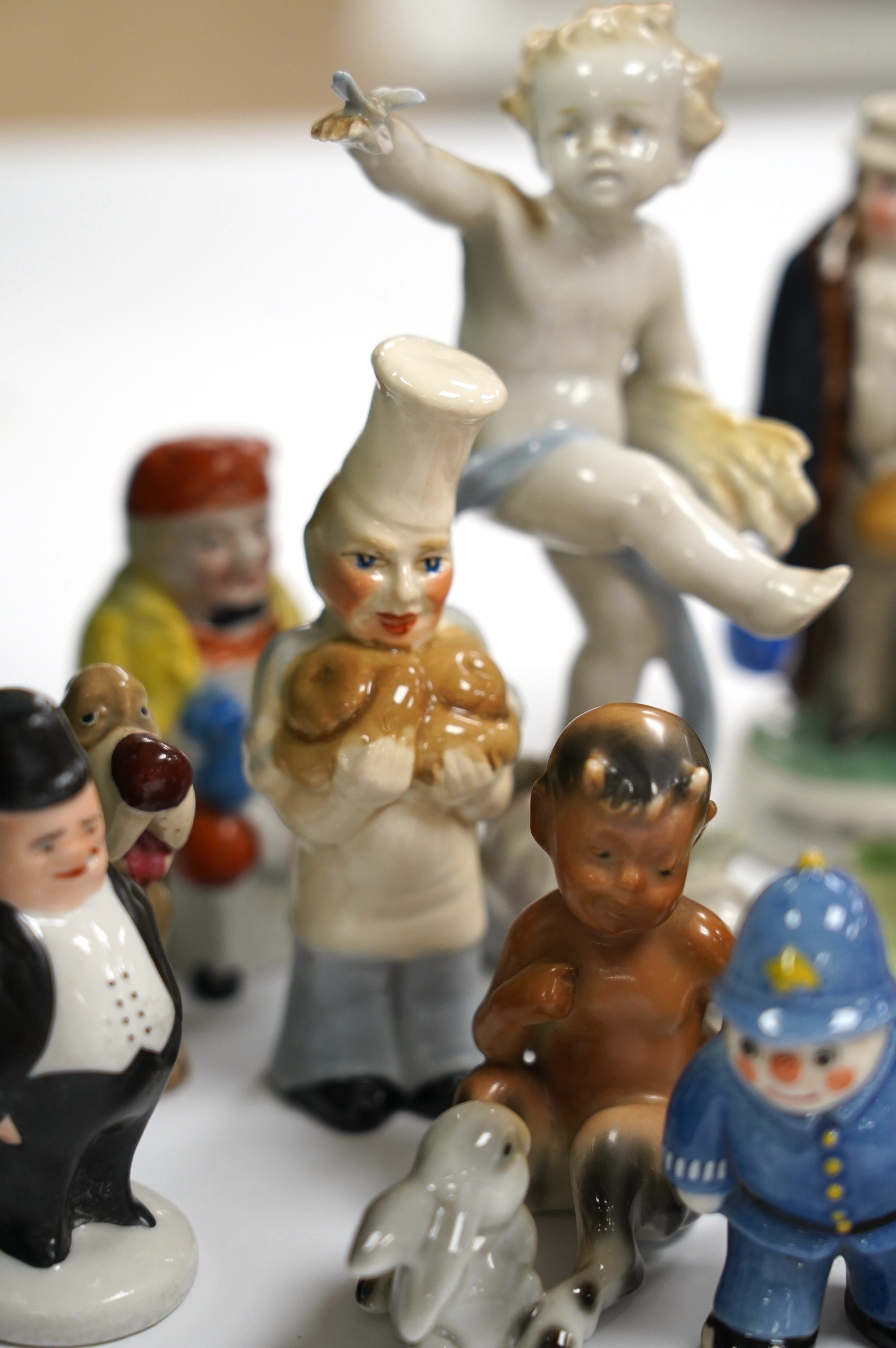 A box of small figures including Wade ceramics, Metzler & Ortloff, etc. highest 12.5cm (14). Condition - fair to good